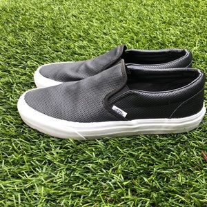 Vans perforated black leather slip ons